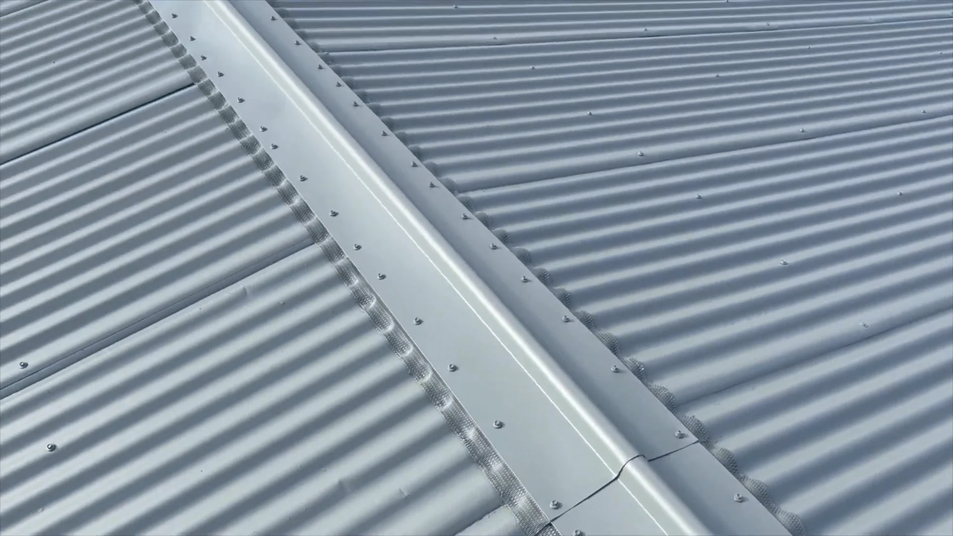 Coated corrugated roof sheets and the repaired ridge during the Pukehangi restoration