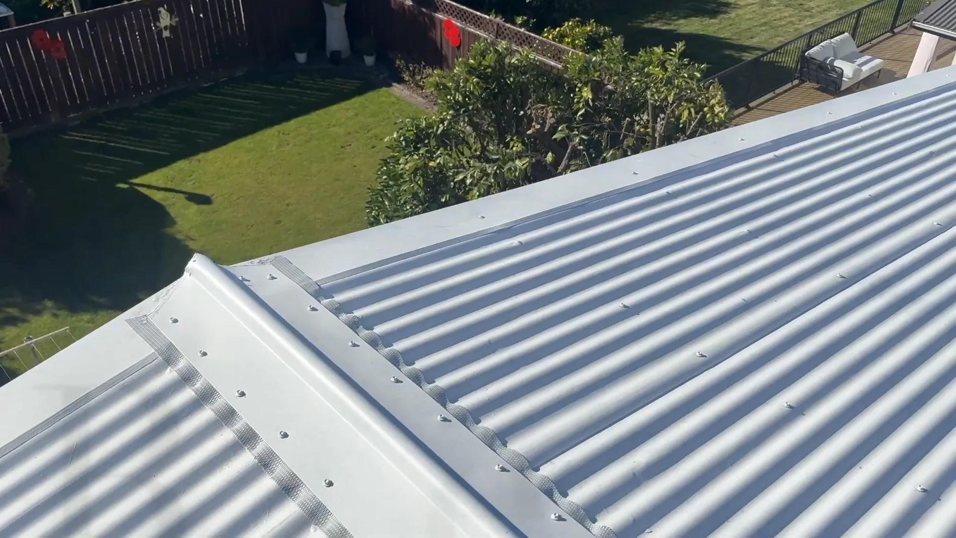 Replacement ridge cap and visible fixings before coating on the Pukehangi roof restoration